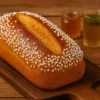 Gâche Vendéenne au Thermomix dorée et saupoudrée de sucre perlé, brioche traditionnelle de Vendée présentée sur une planche en bois.